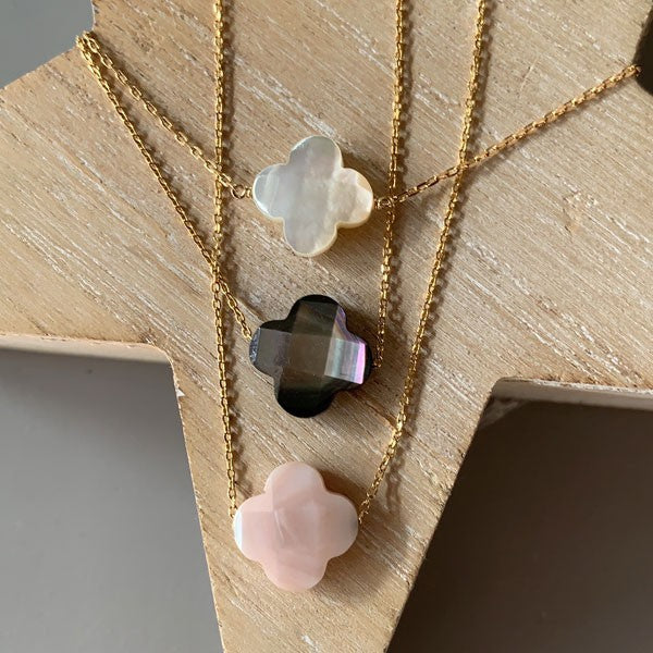 Gold plated chain necklace with faceted pink mother-of-pearl cross 