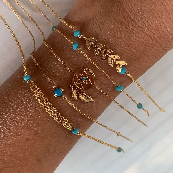 Gold plated chain bracelet with triple chains and small turquoise stones