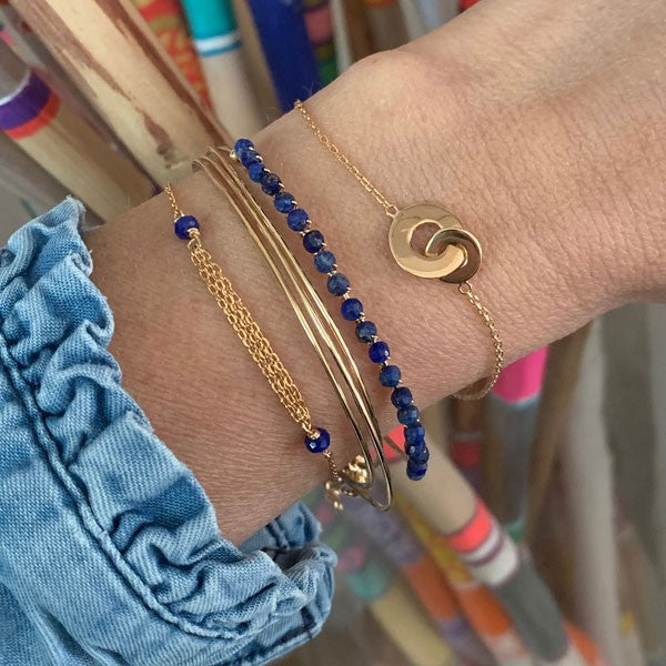 Gold plated chain bracelet with triple chains and small blue stones