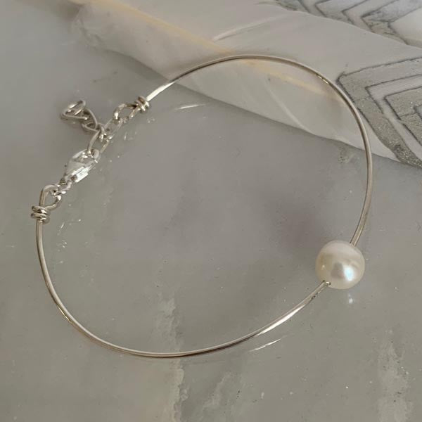 Fine silver bangle bracelet with white pearl