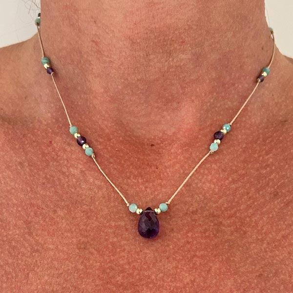 Gold plated chain necklace with oval faceted blue chalcedony